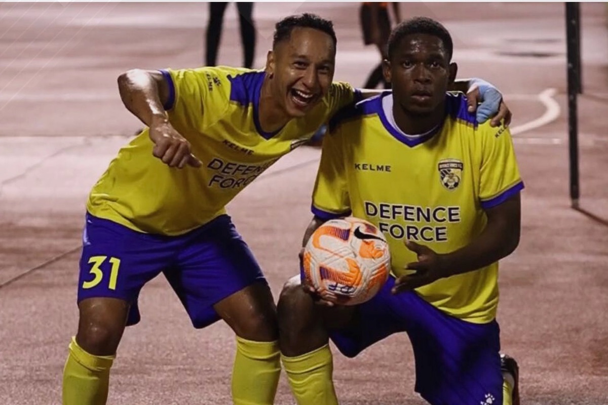 Defence Force's Matthew Woo Ling (left) and Isaiah Leacock (right) celebrate after scoring against AC Port of Spain during the 2024 First Citizens Cup final at the Hasely Crawford Stadium, Mucurapo on Wednesday, May 29th 2024.